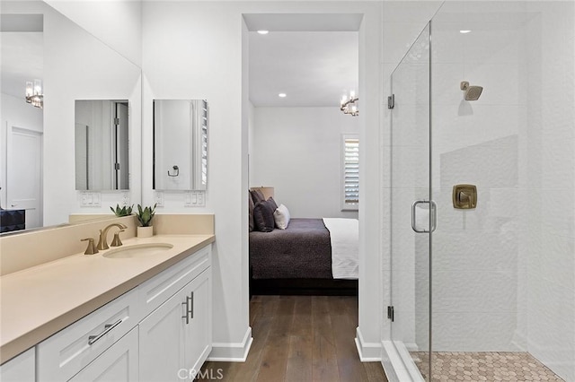 135 Via Artemesia, San Clemente, CA 92672 - full bathroom featuring a stall shower, a chandelier, wood-type flooring, vanity, and ensuite bath