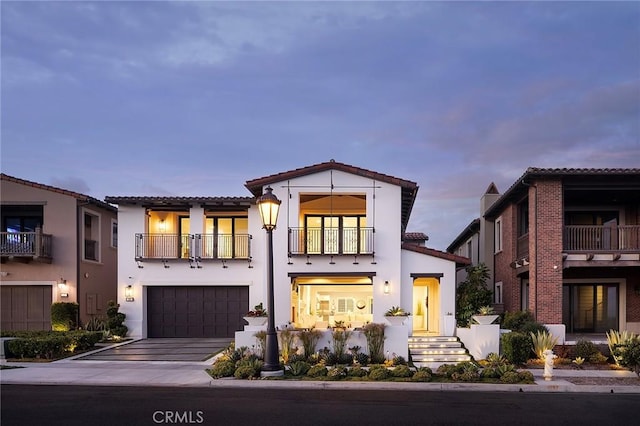 135 Via Artemesia, San Clemente, CA 92672 - mediterranean / spanish home with a balcony, a tiled roof, driveway, a garage, and stucco siding