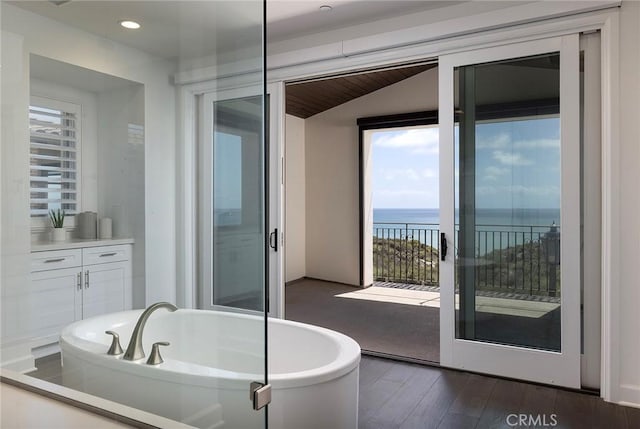135 Via Artemesia, San Clemente, CA 92672 - full bathroom with a freestanding bath, wood-type flooring, a water view, recessed lighting, and vanity