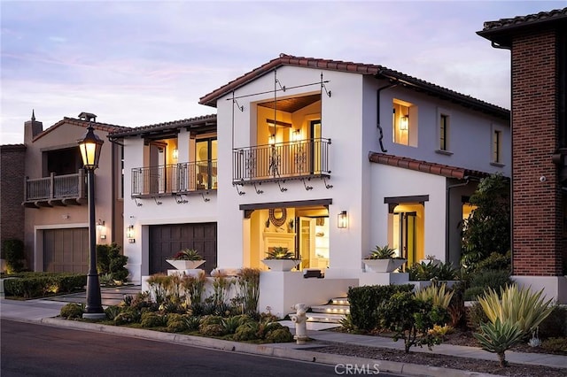 135 Via Artemesia, San Clemente, CA 92672 - mediterranean / spanish-style house with a balcony, a tile roof, an attached garage, and stucco siding
