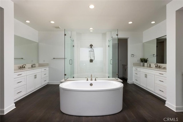 135 Via Artemesia, San Clemente, CA 92672 - full bathroom with a stall shower, two vanities, wood finished floors, a freestanding tub, and recessed lighting