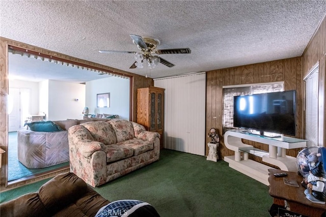 26218 Mccall Blvd, Menifee, CA 92586 - carpeted living room with wood walls, a ceiling fan, and a textured ceiling