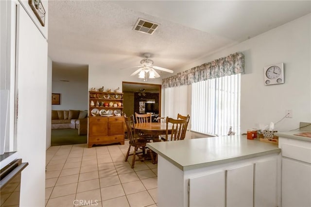 26218 Mccall Blvd, Menifee, CA 92586 - dining area featuring a ceiling fan, light tile patterned floors, and a textured ceiling