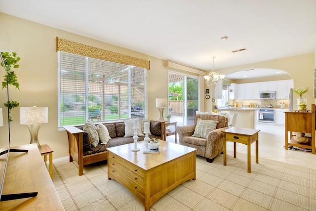 11590 Trailbrook Ln, San Diego, CA 92128 - living area featuring arched walkways and a chandelier