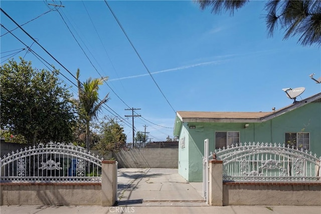 1550 E Sandison St, Wilmington, CA 90744 - view of property exterior with a gate and stucco siding