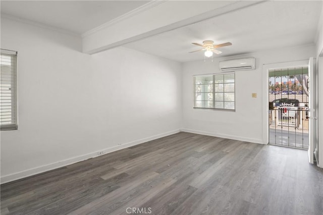 1550 E Sandison St, Wilmington, CA 90744 - spare room featuring an AC wall unit, dark wood finished floors, ceiling fan, ornamental molding, and baseboards