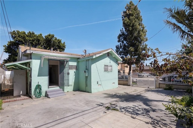 1550 E Sandison St, Wilmington, CA 90744 - view of front of property with a gate, stucco siding, and entry steps