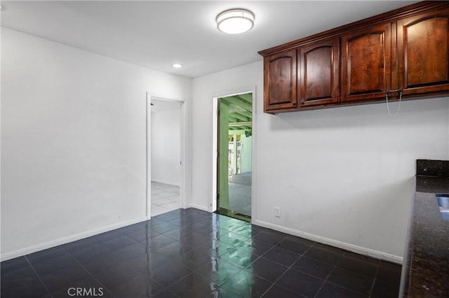 1550 E Sandison St, Wilmington, CA 90744 - empty room featuring baseboards, dark tile patterned flooring, and recessed lighting