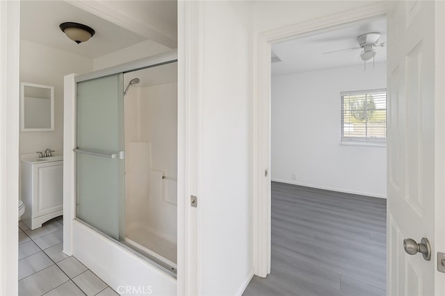 1550 E Sandison St, Wilmington, CA 90744 - bathroom featuring ceiling fan, toilet, wood finished floors, vanity, and baseboards