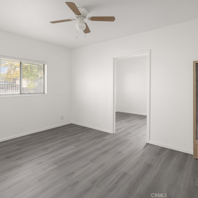 1550 E Sandison St, Wilmington, CA 90744 - unfurnished room with ceiling fan, dark wood-type flooring, and baseboards
