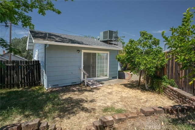 1401 Norton St, Oroville, CA 95966 - rear view of property with central air condition unit, a fenced backyard, and crawl space