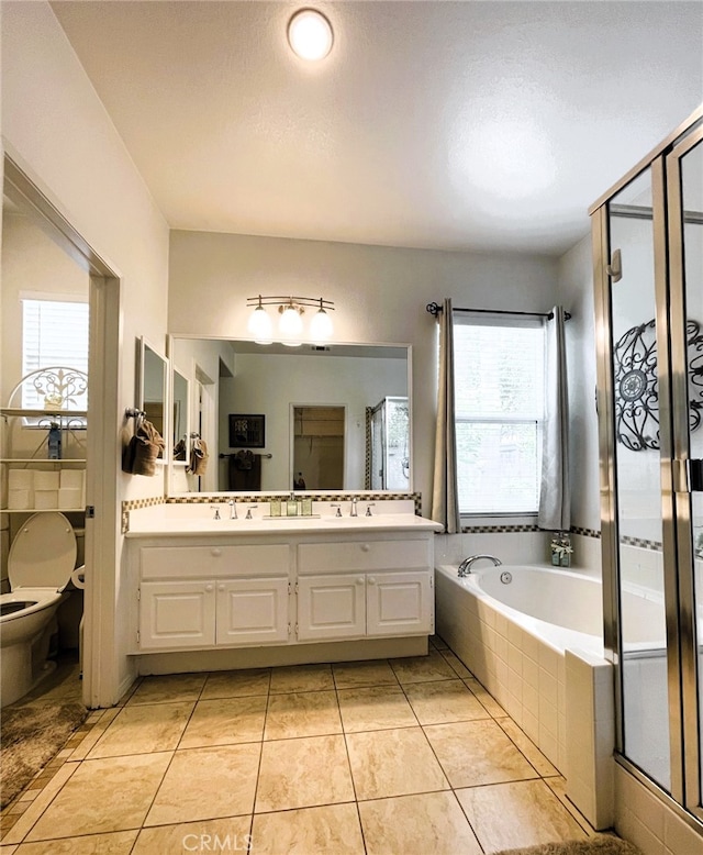 13217 Acacia Ave, Moreno Valley, CA 92553 - bathroom with plenty of natural light, a shower stall, a garden tub, and double vanity