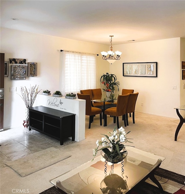 13217 Acacia Ave, Moreno Valley, CA 92553 - living room with a chandelier and light carpet