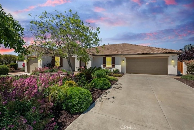 287 Tom Mcguinness Jr Cir, Fallbrook, CA 92028 - view of front of property with stucco siding, driveway, a tiled roof, and an attached garage