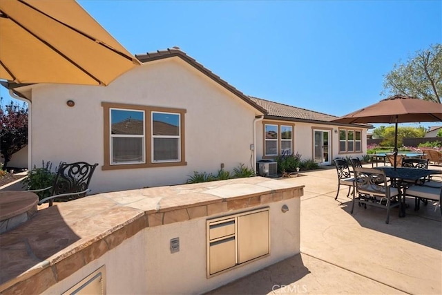 287 Tom Mcguinness Jr Cir, Fallbrook, CA 92028 - view of patio / terrace featuring outdoor dining space, an outdoor kitchen, and central air condition unit
