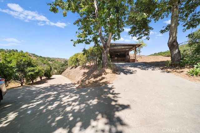 879 Stewart Canyon Rd, Fallbrook, CA 92028 - view of front of house with driveway and a carport