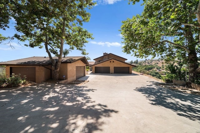 879 Stewart Canyon Rd, Fallbrook, CA 92028 - view of front of house featuring a garage and stucco siding