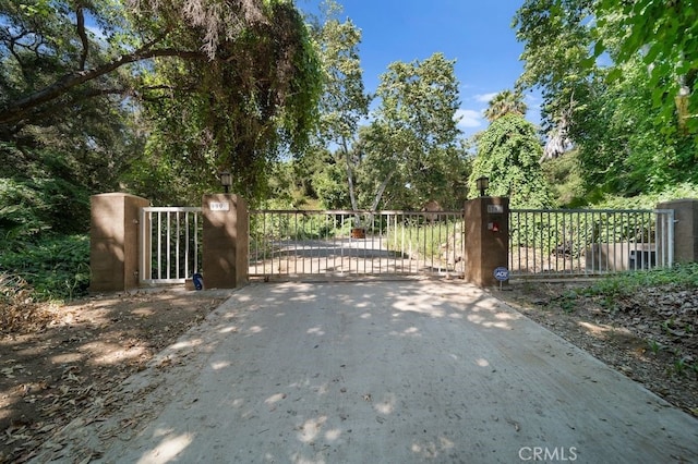 879 Stewart Canyon Rd, Fallbrook, CA 92028 - gate with fence and view of wooded area