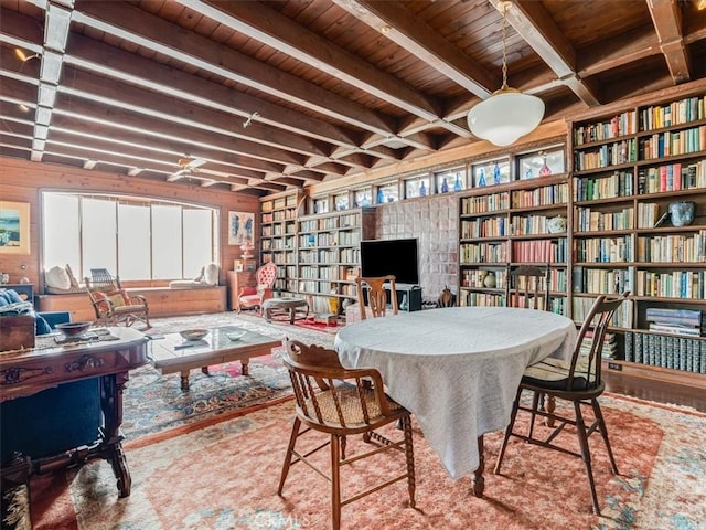6570 Moonstone Beach Dr, Cambria, CA 93428 - sitting room with wooden ceiling, beamed ceiling, bookshelves, and built in shelves
