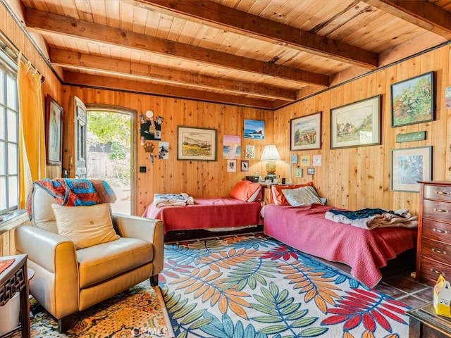 6570 Moonstone Beach Dr, Cambria, CA 93428 - bedroom featuring wooden ceiling, beam ceiling, and wood walls