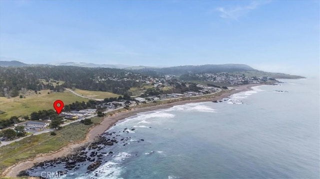 6570 Moonstone Beach Dr, Cambria, CA 93428 - drone / aerial view of a water and mountain view