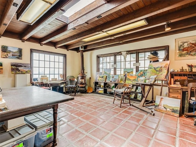 6570 Moonstone Beach Dr, Cambria, CA 93428 - interior space with wooden ceiling, beam ceiling, and a wood stove