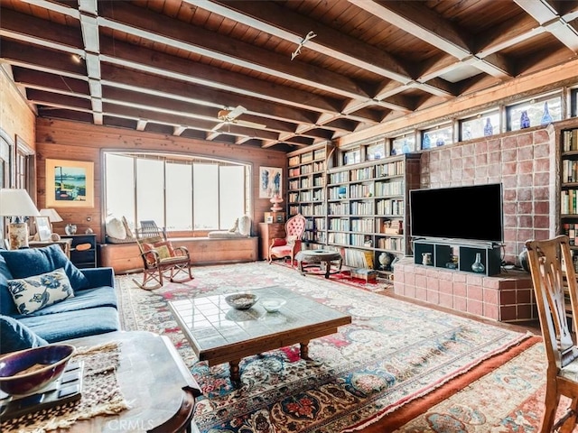 6570 Moonstone Beach Dr, Cambria, CA 93428 - living room featuring wooden ceiling, healthy amount of natural light, beam ceiling, and wood walls