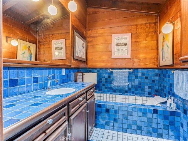 6570 Moonstone Beach Dr, Cambria, CA 93428 - bathroom with tile patterned floors, vanity, wooden walls, and backsplash