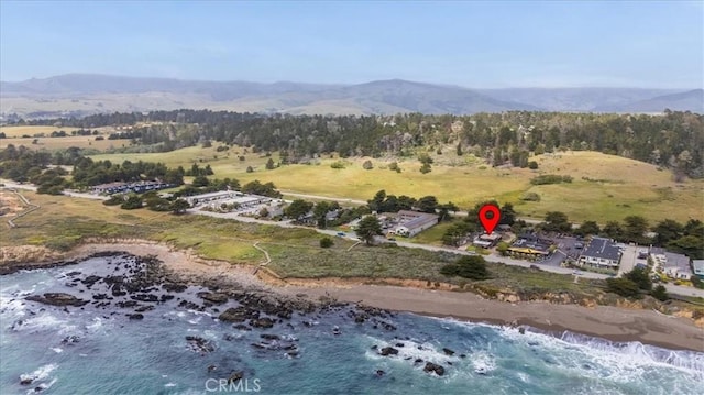 6570 Moonstone Beach Dr, Cambria, CA 93428 - drone / aerial view of a mountain backdrop and a heavily wooded area