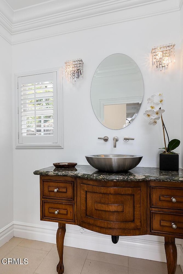 15450 Briarwood Dr, Sherman Oaks, CA 91403 - bathroom featuring vanity, tile patterned floors, baseboards, and crown molding