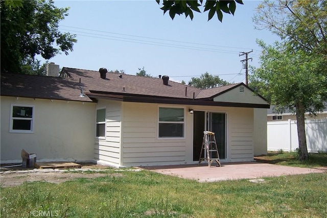 3069 N F St, San Bernardino, CA 92405 - back of house with a patio area, roof with shingles, and a chimney