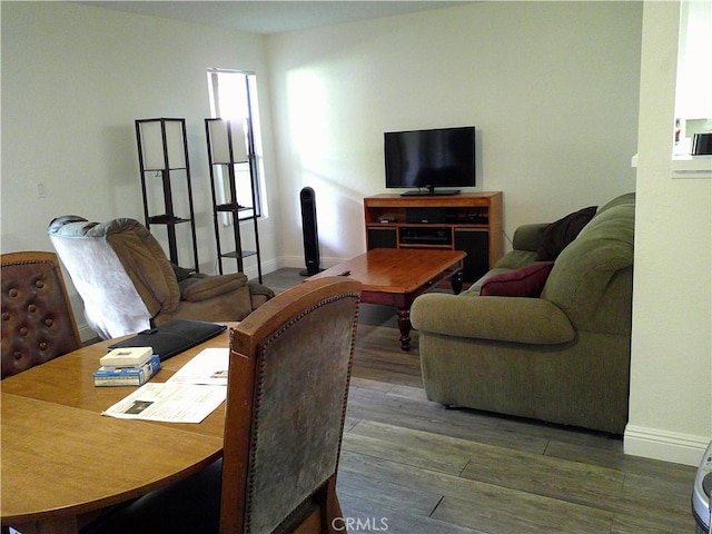 living room with wood finished floors and baseboards
