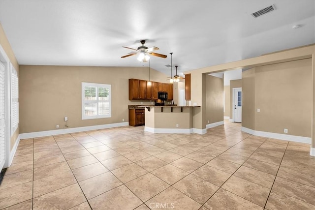 7566 Fox Trl, Yucca Valley, CA 92284 - unfurnished living room featuring light tile patterned flooring, ceiling fan, lofted ceiling, and baseboards