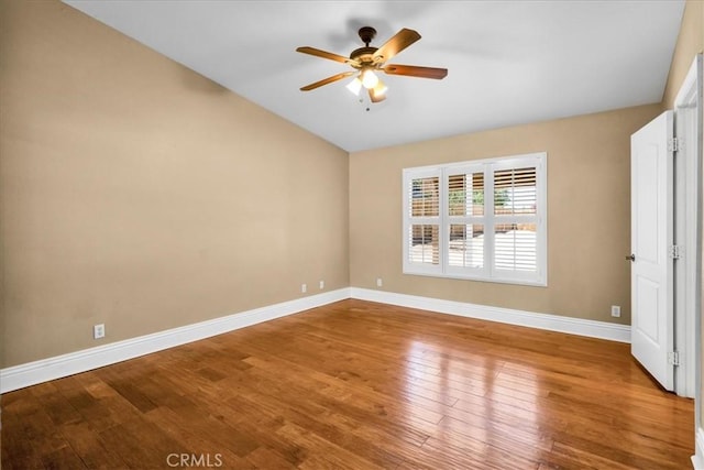 7566 Fox Trl, Yucca Valley, CA 92284 - spare room featuring baseboards, a ceiling fan, wood finished floors, and vaulted ceiling