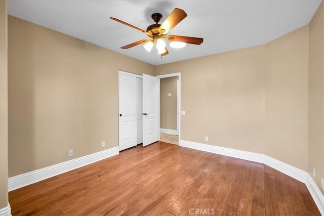 7566 Fox Trl, Yucca Valley, CA 92284 - spare room featuring ceiling fan, baseboards, and light wood finished floors