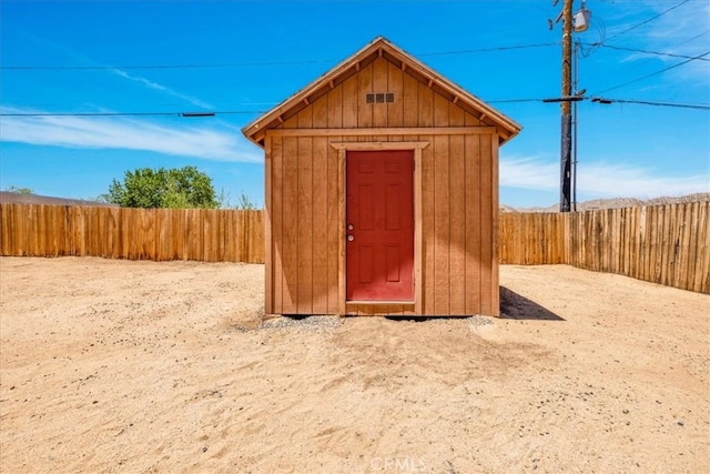 7566 Fox Trl, Yucca Valley, CA 92284 - view of shed with a fenced backyard