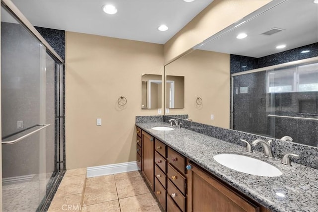 7566 Fox Trl, Yucca Valley, CA 92284 - full bath featuring baseboards, a shower stall, double vanity, tile patterned flooring, and recessed lighting