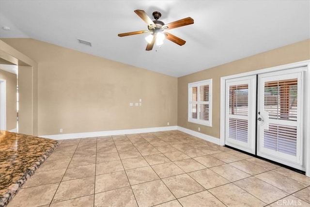 7566 Fox Trl, Yucca Valley, CA 92284 - spare room with vaulted ceiling, ceiling fan, light tile patterned flooring, and baseboards