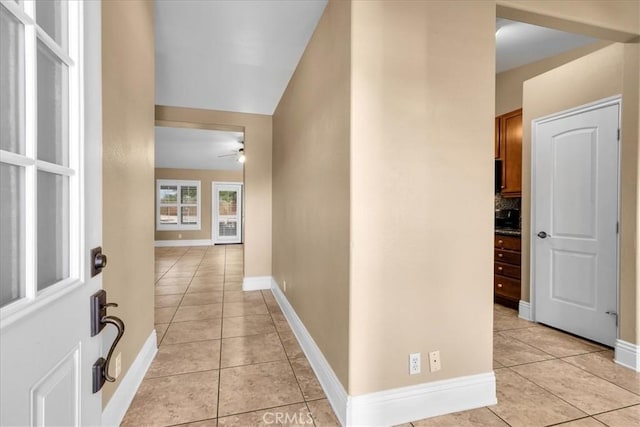 7566 Fox Trl, Yucca Valley, CA 92284 - hall featuring light tile patterned floors, baseboards, and vaulted ceiling