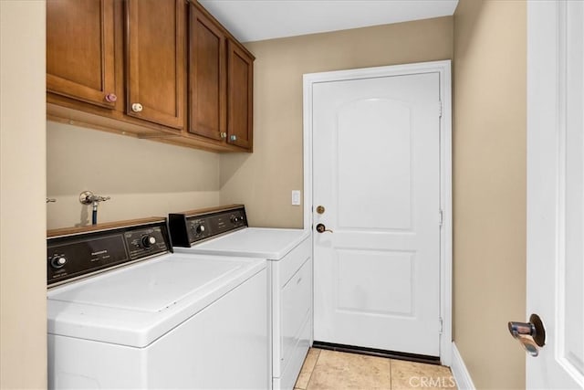 7566 Fox Trl, Yucca Valley, CA 92284 - laundry room featuring independent washer and dryer, cabinet space, light tile patterned floors, and baseboards