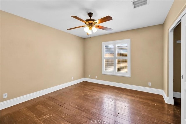 7566 Fox Trl, Yucca Valley, CA 92284 - unfurnished bedroom featuring baseboards, wood finished floors, and ceiling fan