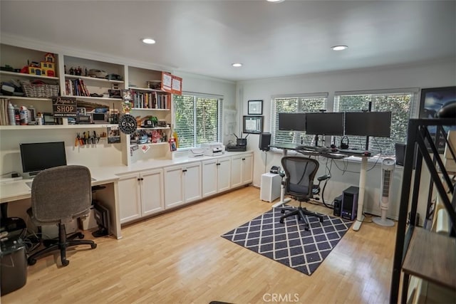 home office featuring light wood finished floors, ornamental molding, and recessed lighting