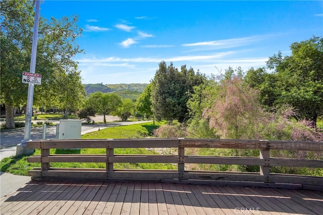 wooden deck featuring a mountain view