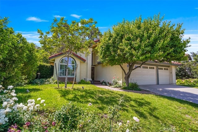 obstructed view of property with concrete driveway, an attached garage, stucco siding, and a front yard