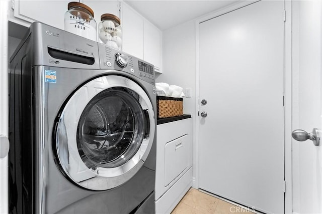 28705 Charreadas, Laguna Niguel, CA 92677 - laundry room with washer and clothes dryer and light tile patterned floors