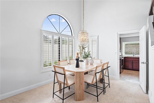 28705 Charreadas, Laguna Niguel, CA 92677 - dining space with a chandelier, plenty of natural light, baseboards, and a high ceiling