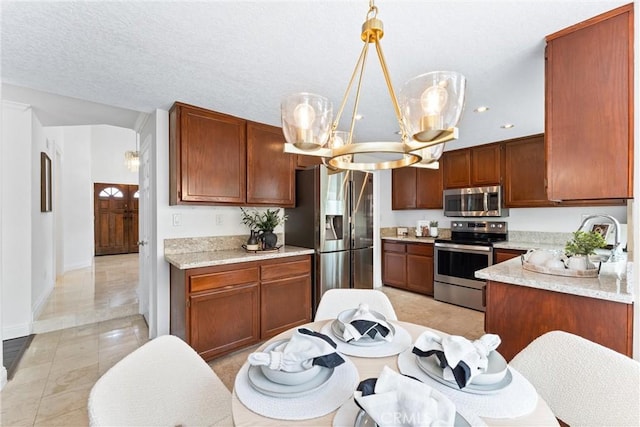28705 Charreadas, Laguna Niguel, CA 92677 - kitchen featuring stainless steel appliances, a chandelier, baseboards, recessed lighting, and pendant lighting