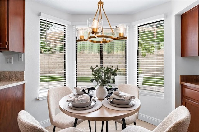 28705 Charreadas, Laguna Niguel, CA 92677 - dining area with baseboards, a chandelier, and healthy amount of natural light