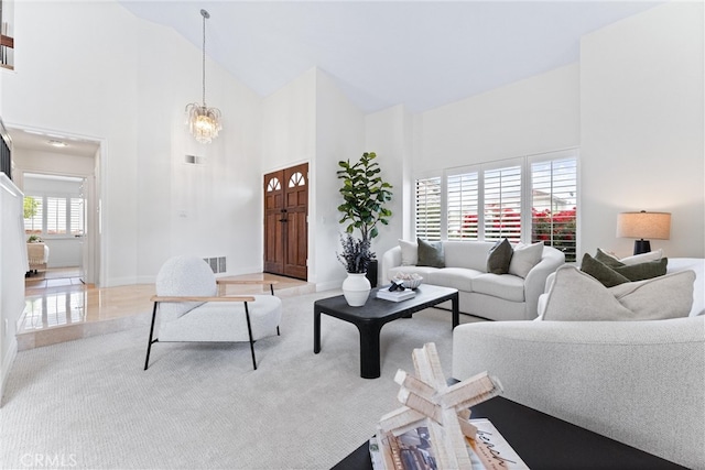 28705 Charreadas, Laguna Niguel, CA 92677 - living room with high vaulted ceiling, a chandelier, and baseboards