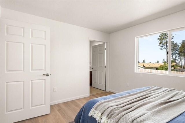 6333 Graham Rd, Paradise, CA 95969 - bedroom with light wood finished floors and baseboards